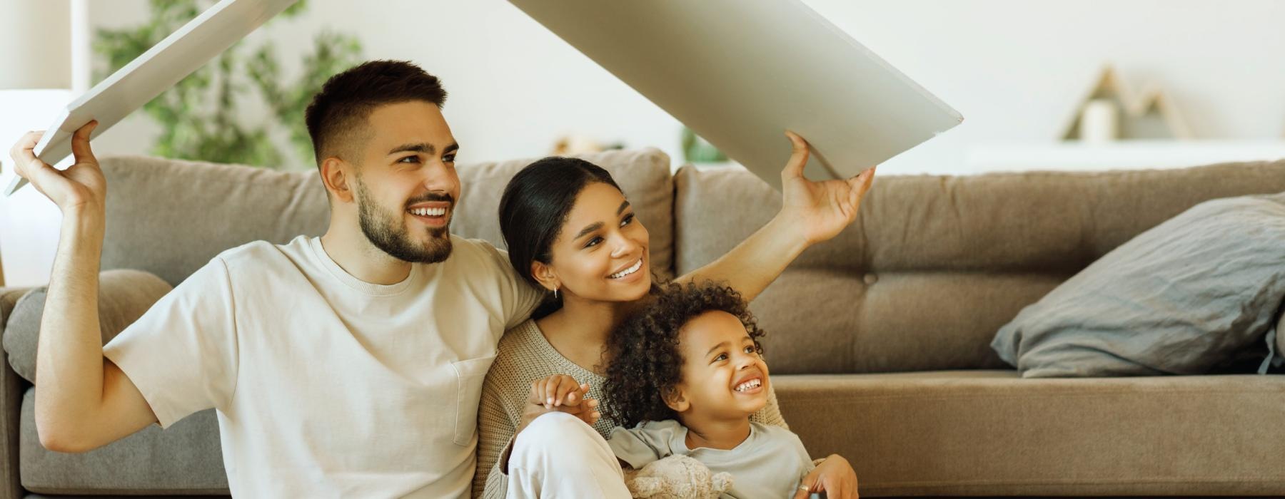 a man and woman holding a baby