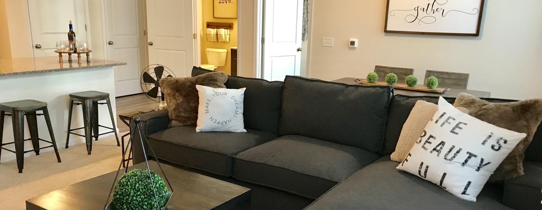 a living room with a couch and coffee table