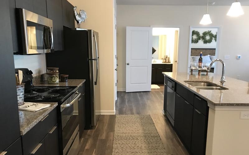 a kitchen with black appliances